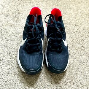 Red black and white Nike shoes